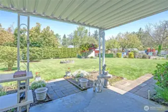 A covered patio creates the perfect spot to unwind and enjoy the outdoors.