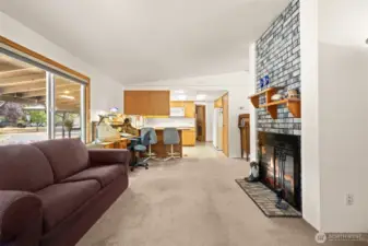 Cozy fireplace and separate living and family rooms.