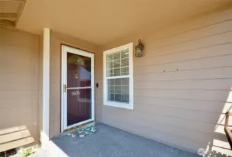 Welcoming covered front porch and swing.