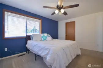 Primary bedroom light and bright with walk in closet and bath off master. 11 x 13 very nice size.