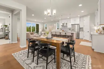 Main level dining area with access to covered deck.