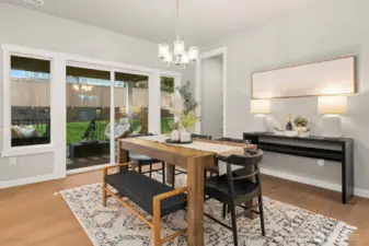 Main level dining area with access to covered deck.