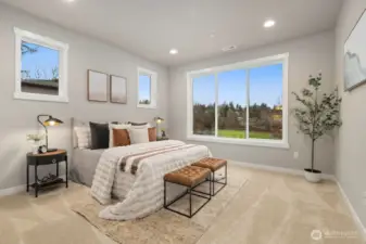 Owner's Suite on the main level with private bath and generous walk-in closet.