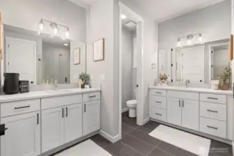 Luxurious bathroom in Owner's Suite with double vanity and walk-in shower.