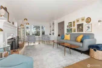 Living room looking back to the front of the home with built-in bookcases
