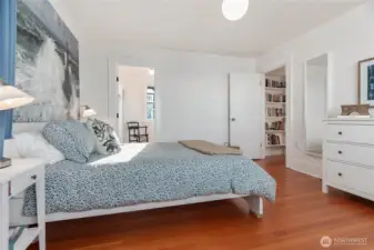 Another look at the primary bedroom leading to the ensuite bathroom