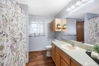 Upstairs full bathroom with lots of counter space.