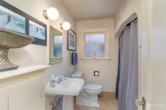 Main floor bathroom with tub and shower combo