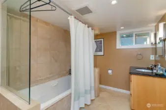 Updated full bath in lower level. Currently being used as a guest rental but could also be a great primary suite.