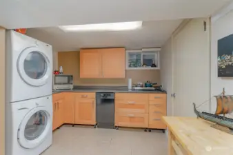 Full-sized washer and dryer. Door leads to garage.
