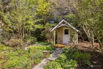 Super cute outbuilding/playhouse currently used as an adorable storage shed.