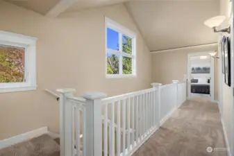 Vaulted ceilings and lots of natural light fill the home's 2nd level landing.