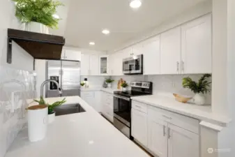 White shaker cabinets, quartz counters, stainless appliances