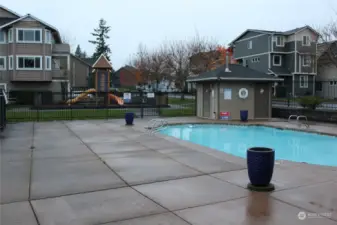 pool with playground in the backgroud