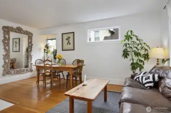 Main level unit with a large living room/dining space, with fir floors throughout.