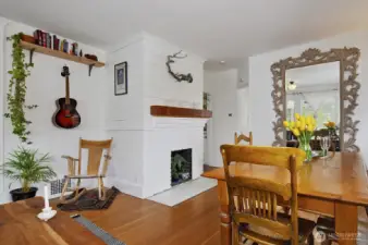 Wood burning fireplace, original 1911 planks on the wall. There is a new electrical furnace and heat pump that provides central heat and A/C to the home.