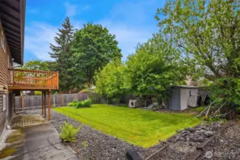 Newer back deck and gorgeous lawn.