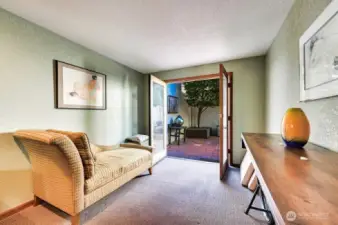 MAIN LEVEL BEDROOM WITH FRENCH DOORS TO COURTYARD