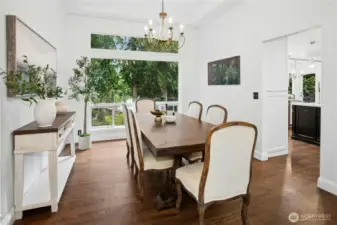 Open and airy main level with hardwood floors and lake views from the formal dining room - perfect for entertaining in your Sammamish lakefront estate.