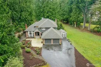 Sweeping driveway approach through lush evergreens - an ideal blend of seclusion and space on a shy acre near Beaver Lake. Only minutes to I-90, shops, schools and other local amenities.