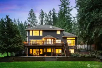Sprawling backyard and multi-level deck with direct lake access, this Sammamish retreat blends comfort, privacy, and Northwest charm.