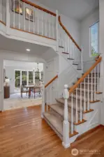 Open two-story entry with hardwood floors