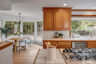 Open kitchen with eating nook and doors out to the rear yard