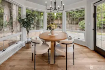 Nook off the kitchen with floor to ceiling windows, offering lots of natural light