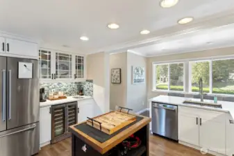 Expansive windows in the kitchen fill the room with light and provide views while preparing meals and entertaining in the kitchen.