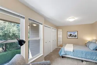 The second bedroom also boasts a wall of closets and plenty of room to keep everything tidy and well organized.
