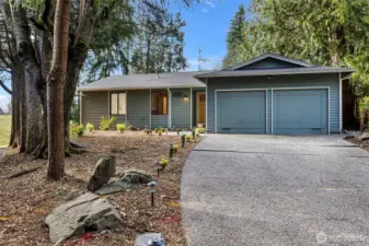 Refreshed Bridle Trails home sited on private, large lot bordering lovely Taylor Fields Park and trails.