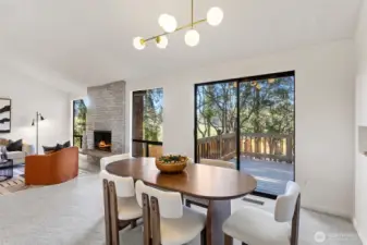 The dining room features a sliding glass door adjoining an entertainment sized deck overlooking park-like grounds as well as “literal” park.