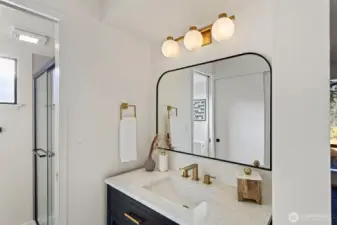 Newly refreshed en-suite bath features new vanity, brushed gold faucet, shower pan and surround and flooring.  It also has a second closet.