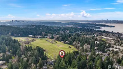 This drone shot features downtown Bellevue, downtown Seattle and Lake Washington.  Kirkland is directly west and the lake is very close to this home.