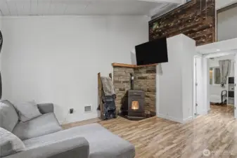 View of your living room from entry, more storage above, full bath straight ahead by bedrooms.