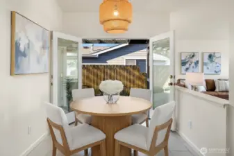 The dining area has french doors which open to a spacious covered patio.