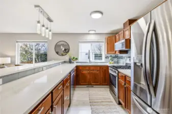 Newer light fixtures and stainless steel appliances.