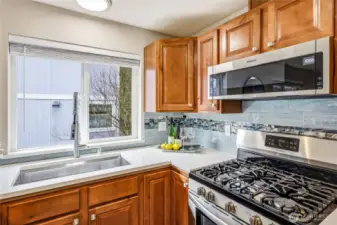 The gas top stove and deep kitchen sink is a chefs dream!