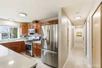 A view of the hallway with the luxury vinyl floor throughout.