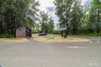 Trailhead parking and bathroom across street from lake.