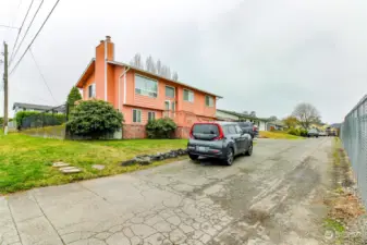 As you turn right down the easement road, the first home on the corner is a split level and the second home is the subject property