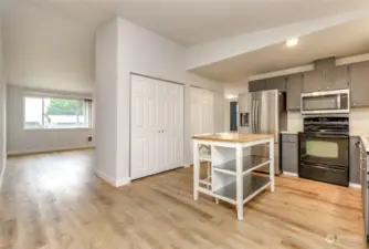 The kitchen is open to the family room and storage and the corner is the living room