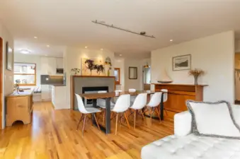 Open living/dining area with views and beautiful custom fireplace.