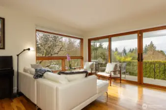 Light-drenched living room with views from the couch and the attached balcony.