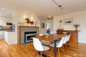 Open living/dining area with views and beautiful custom fireplace.