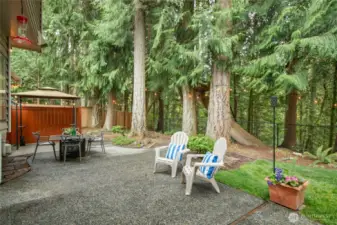 A covered area for entertaining at the end of the patio.