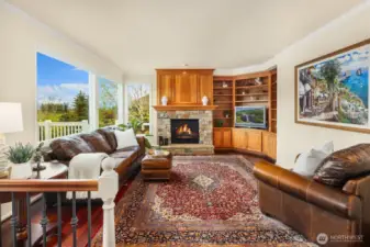 Relax in the comfy family room with fireplace & beautiful built-ins.