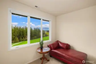 4th upstairs bedroom looking out to the golf course & mountains.
