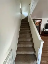 Stairway up to 3 bedrooms.
