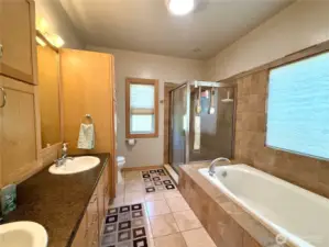 Primary Bathroom with Soaking Tub, Shower, and Double Sinks